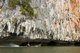Thailand: Boatman next to undercut cliff, Ao Phang Nga (Phangnga Bay) National Park, Phang Nga Province